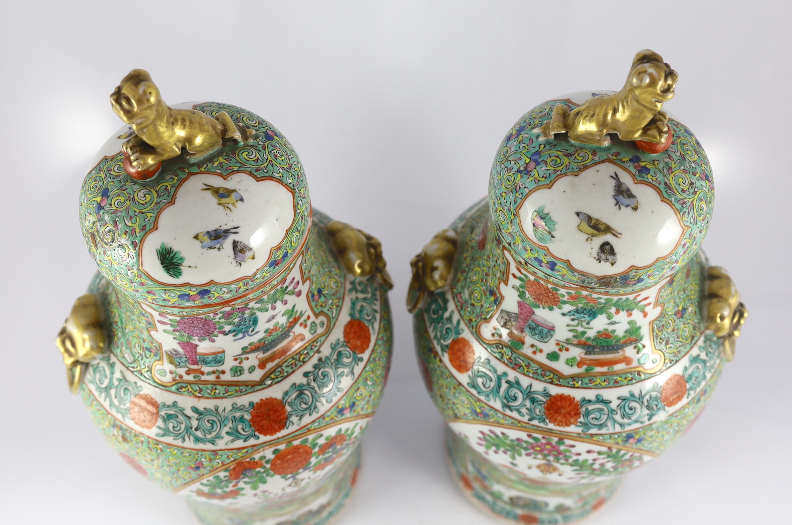 A pair of Chinese enamelled porcelain vases and covers, early 20th century